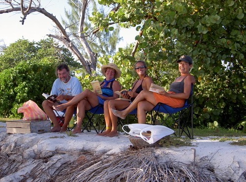 Swapping books while Greg barbecued our fish © SW